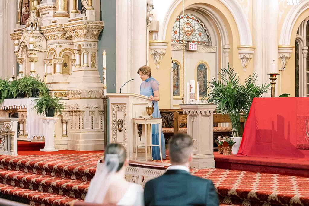 Bridesmaid shares a reading at St. Michaels church at Old Town