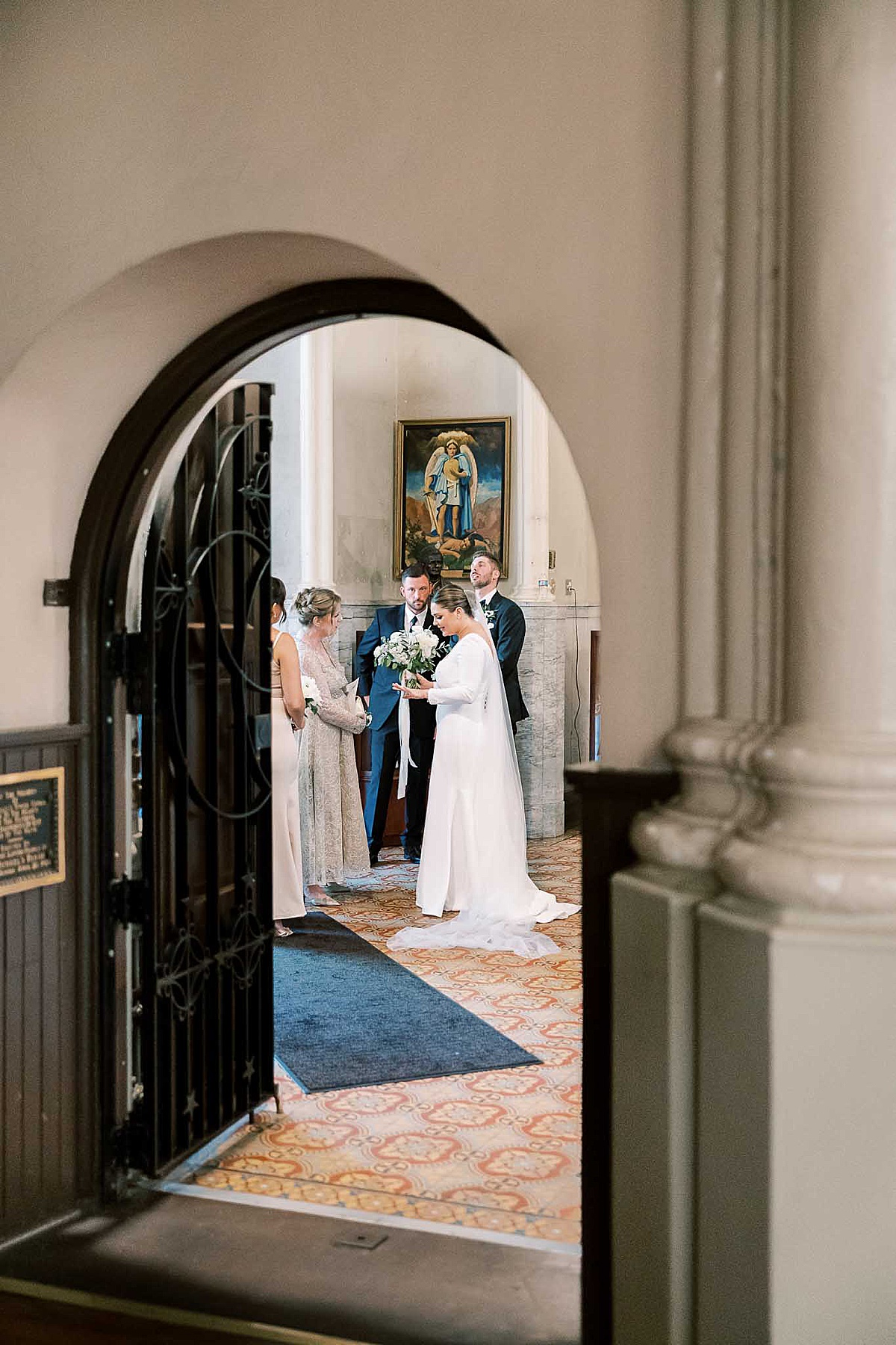 Bride and family admire ring after church