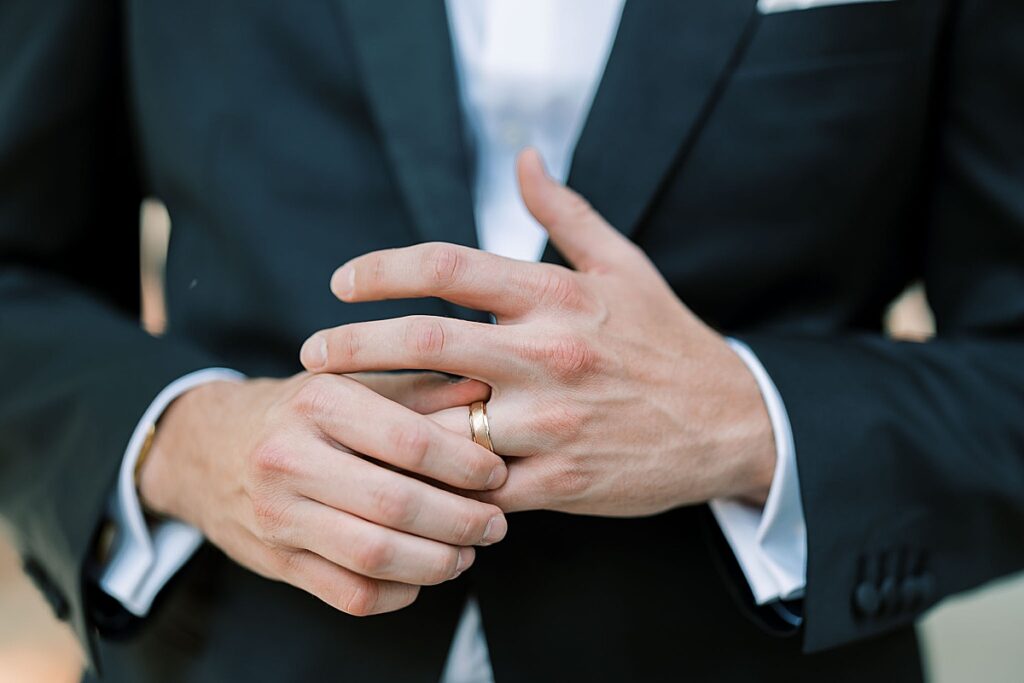 Man adjusting wedding ring