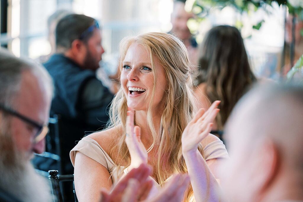 Woman in dress with long hair claps