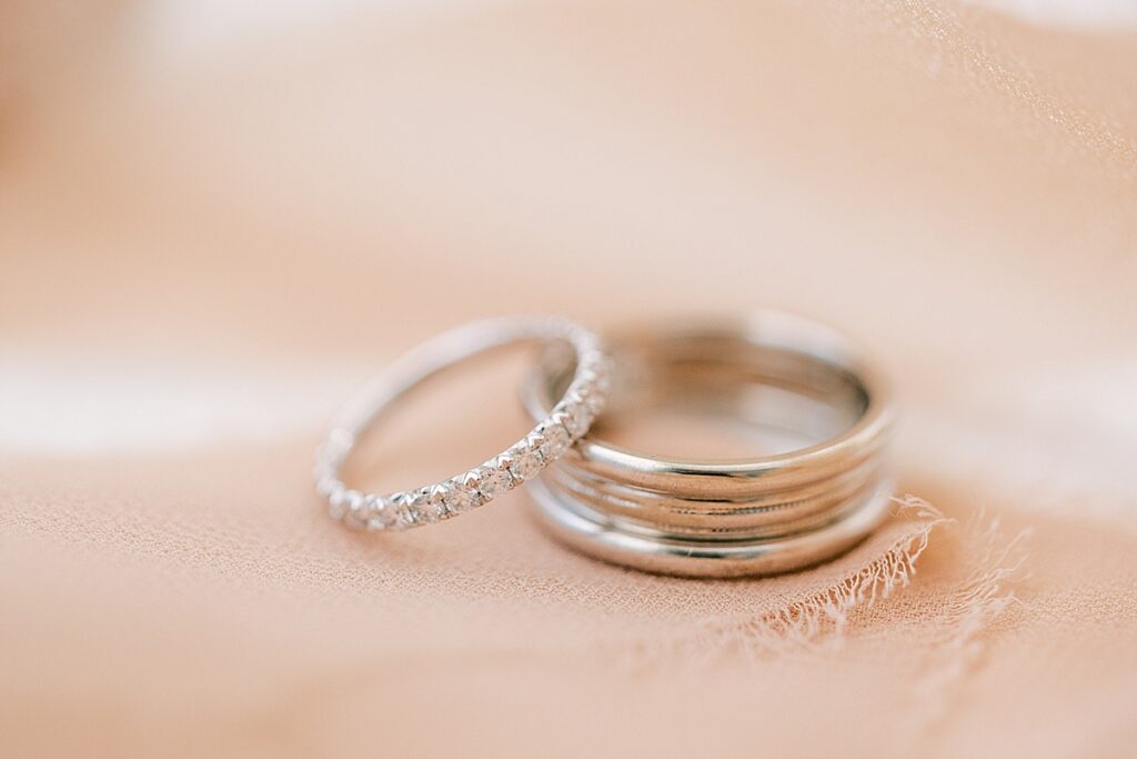 Macro photograph of Tacori wedding rings with pink ribbon