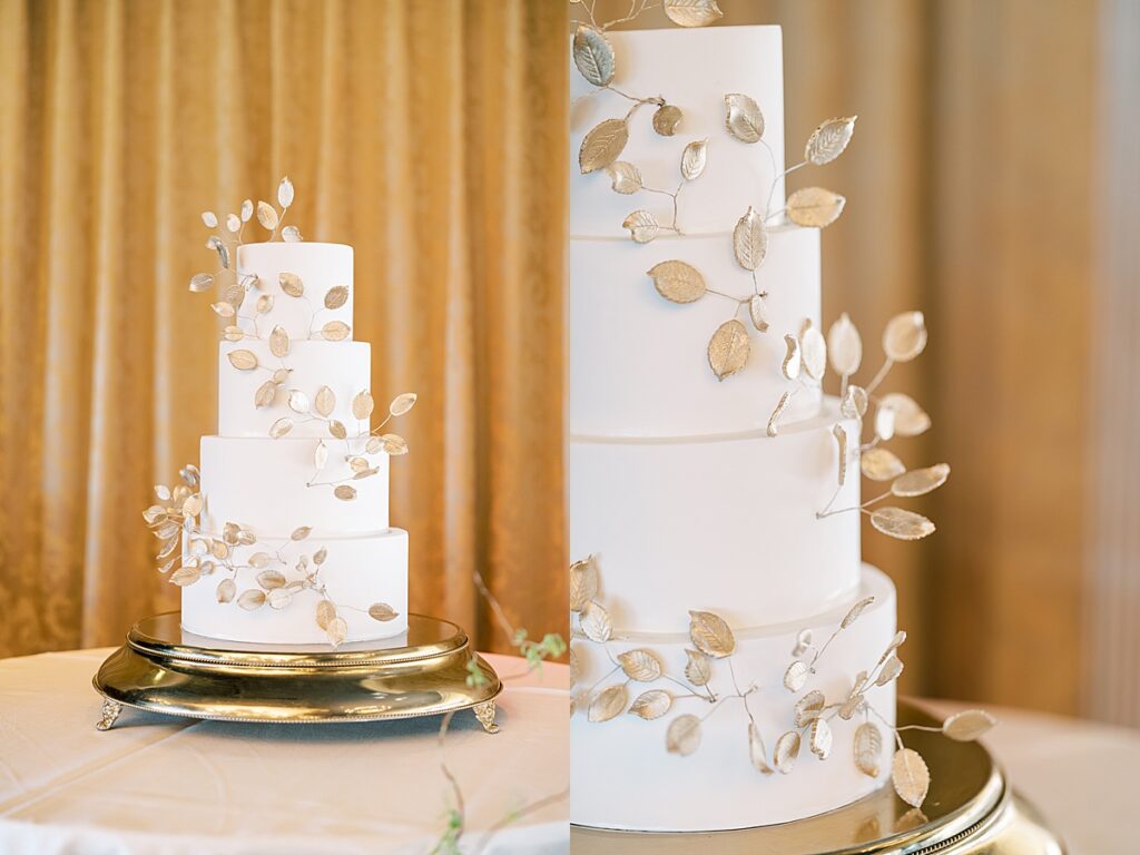 White wedding cake with gold leaves against a gold background