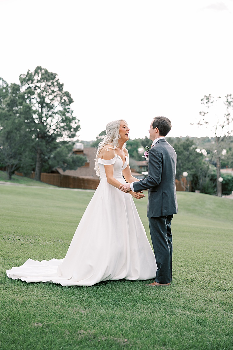 Couple smiling at each other after their first look on their wedding