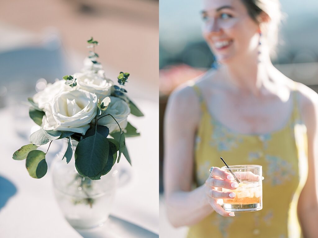 Woman in yellow dress smiling holding drink