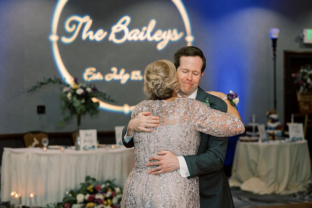 Man hugging a woman on dance floor