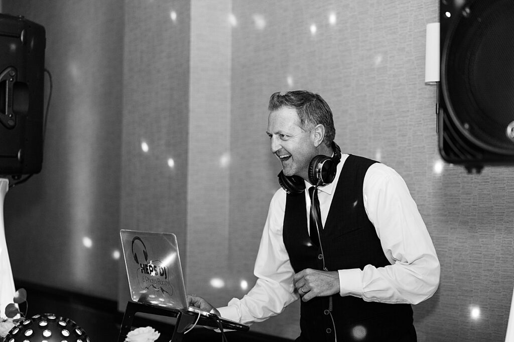 DJ smiling playing music at wedding