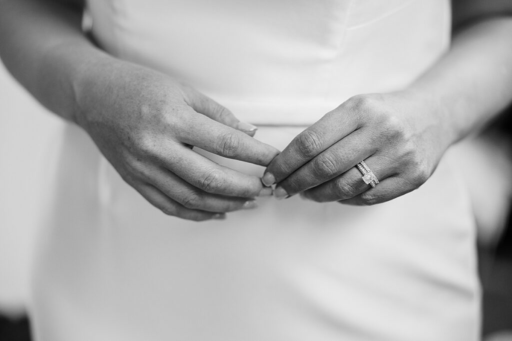 Black and white photo of bride's hands