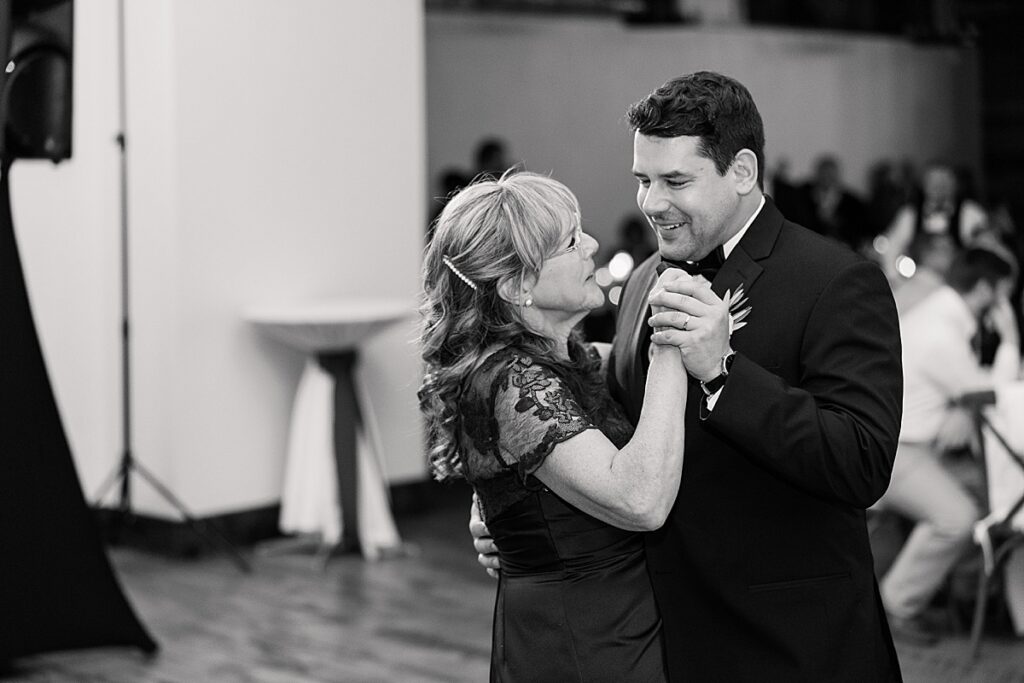 Groom dancing with his mom at wedding