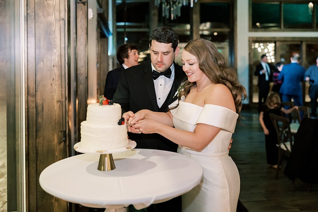 Couple cutting their wedding cake