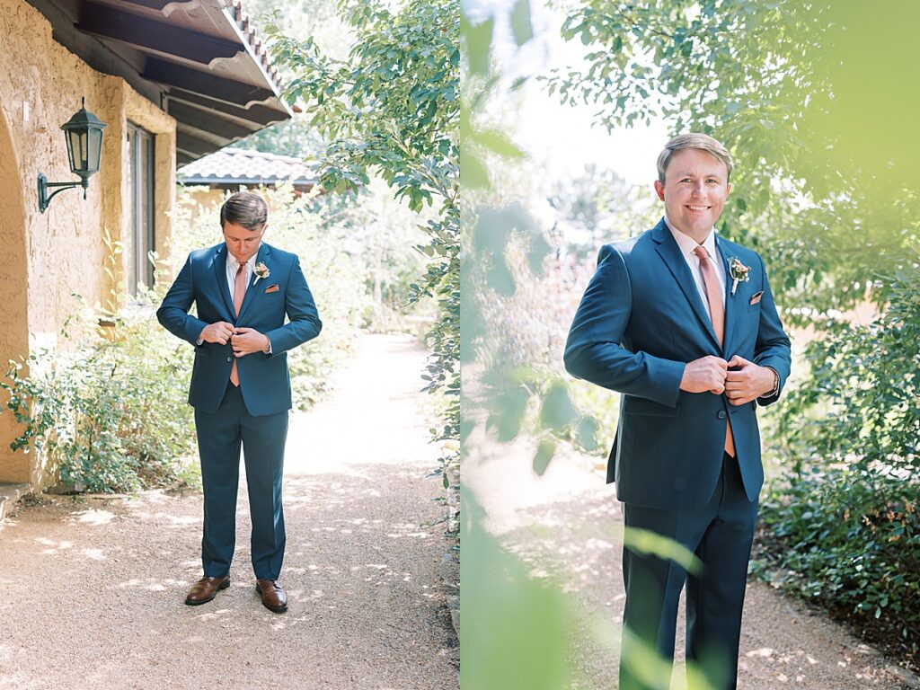 Groom in blue suit buttoning buttons standing outside