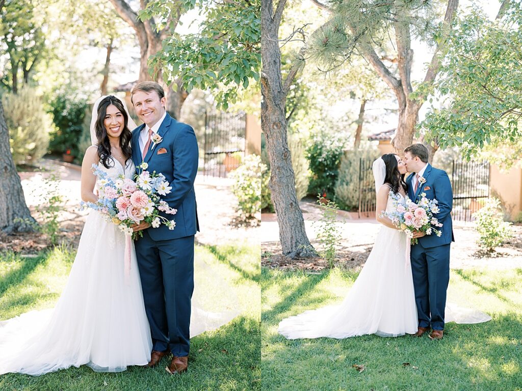 Bride in white dress and groom in blue suit standing in front of trees