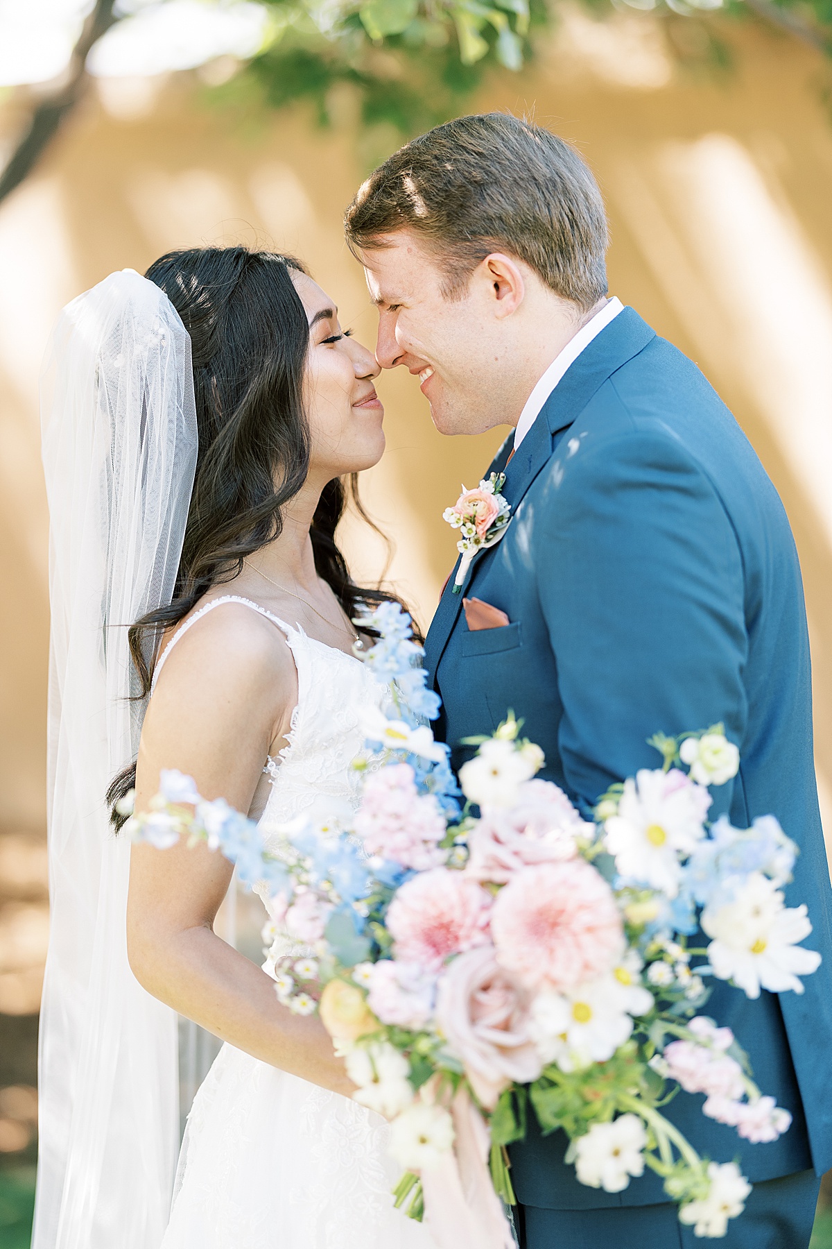 Bride and groom rubbing noses