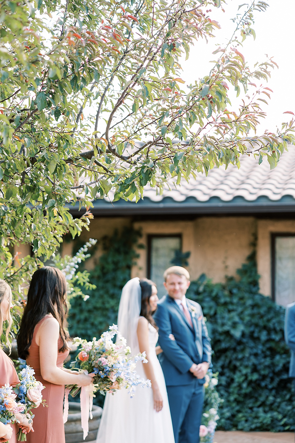 Groom looking at bride during wedding ceremony