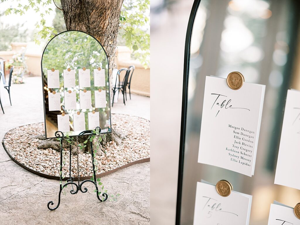 Wedding reception table numbers on a mirror