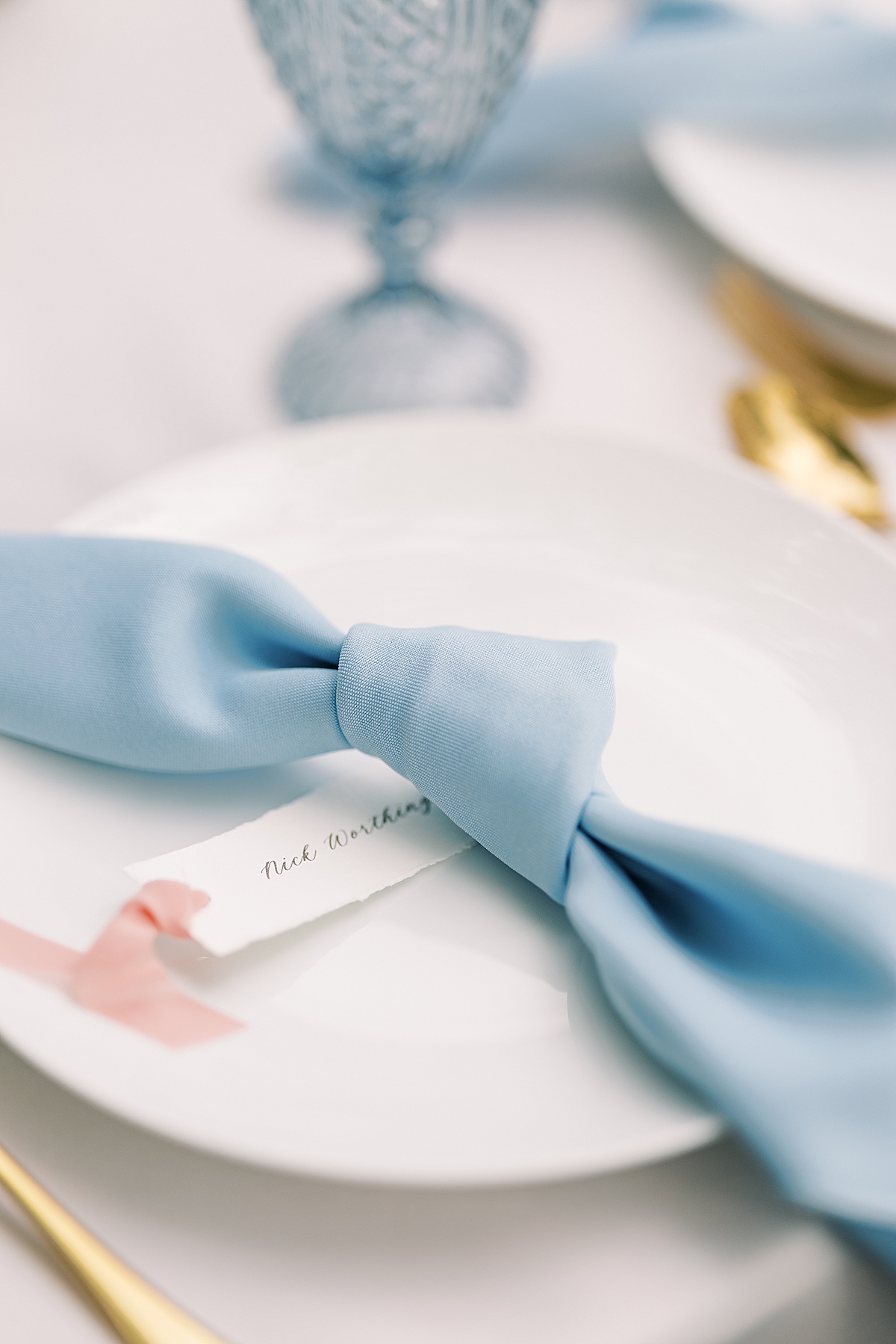 Blue napkin at wedding place setting