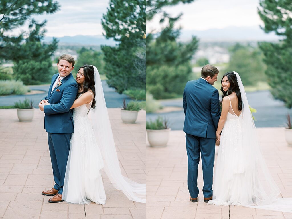 Bride and groom pose with long veil