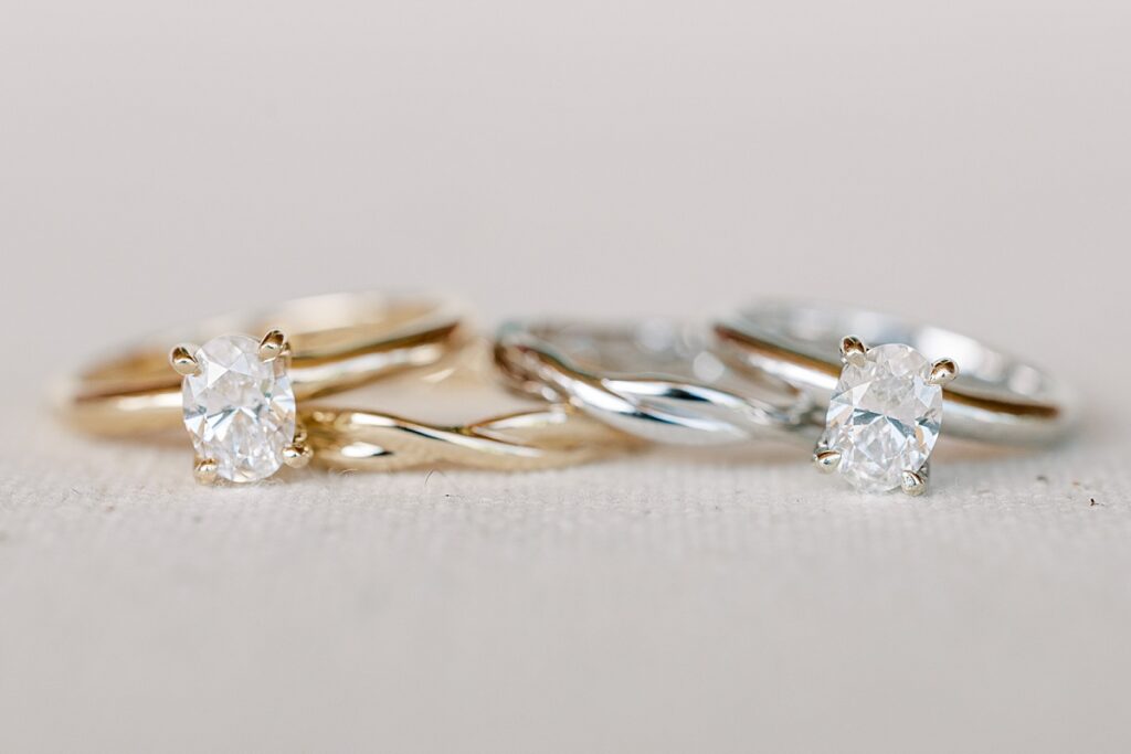 A gold and silver matching engagement rings for two brides