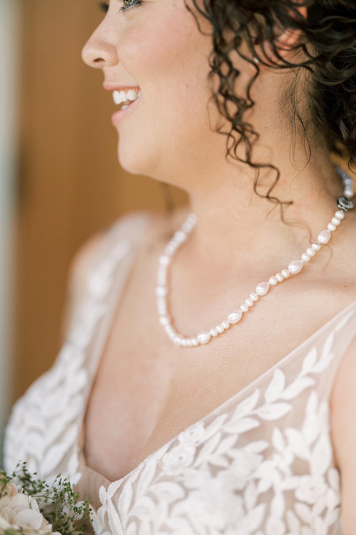 Up close photo of bride's pearl necklace