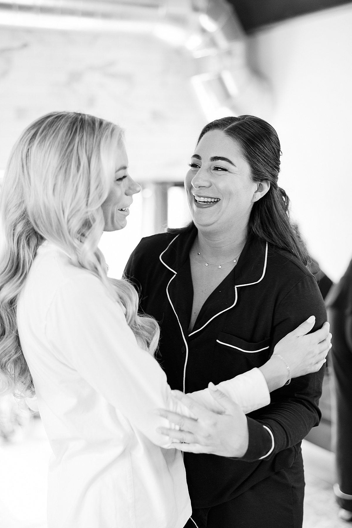 Smiling bridesmaid in black robe