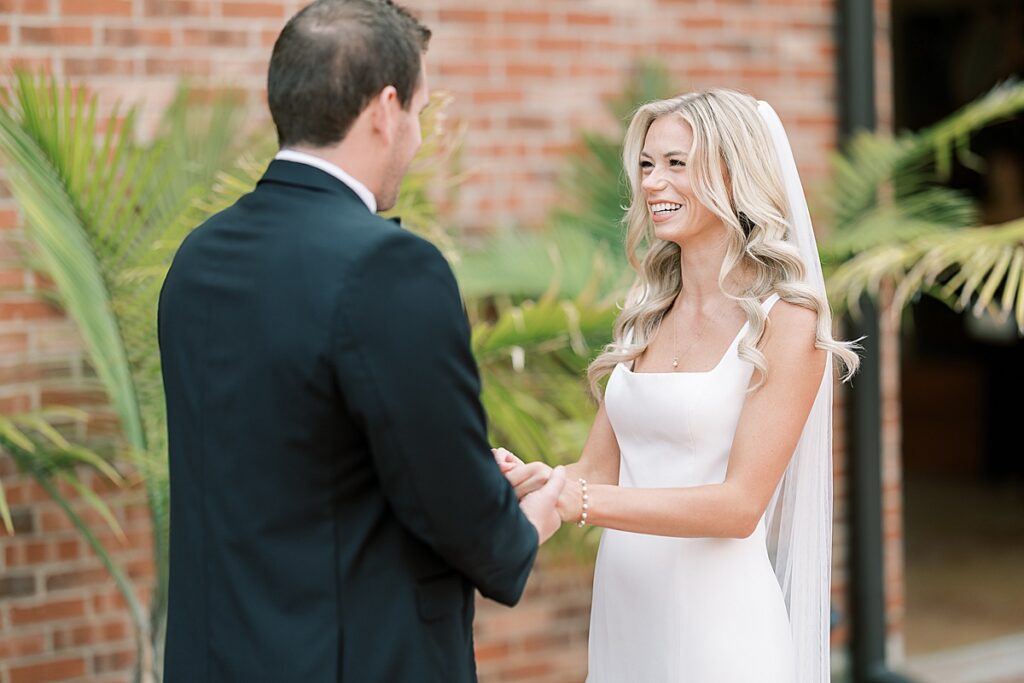 Bride smiling up and groom