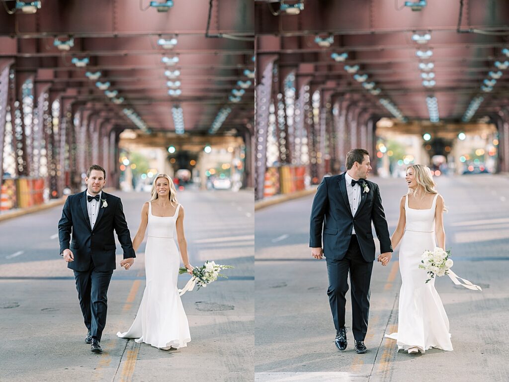 Bride and groom walking under maroon overpass