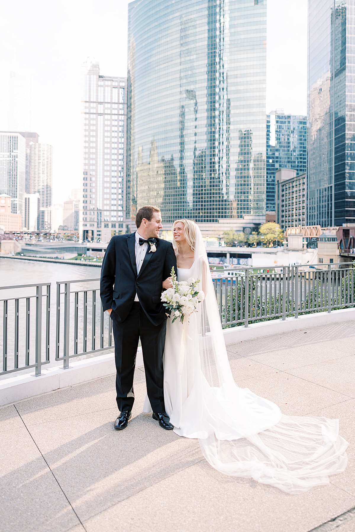 Couple posing in front of the Chicago River