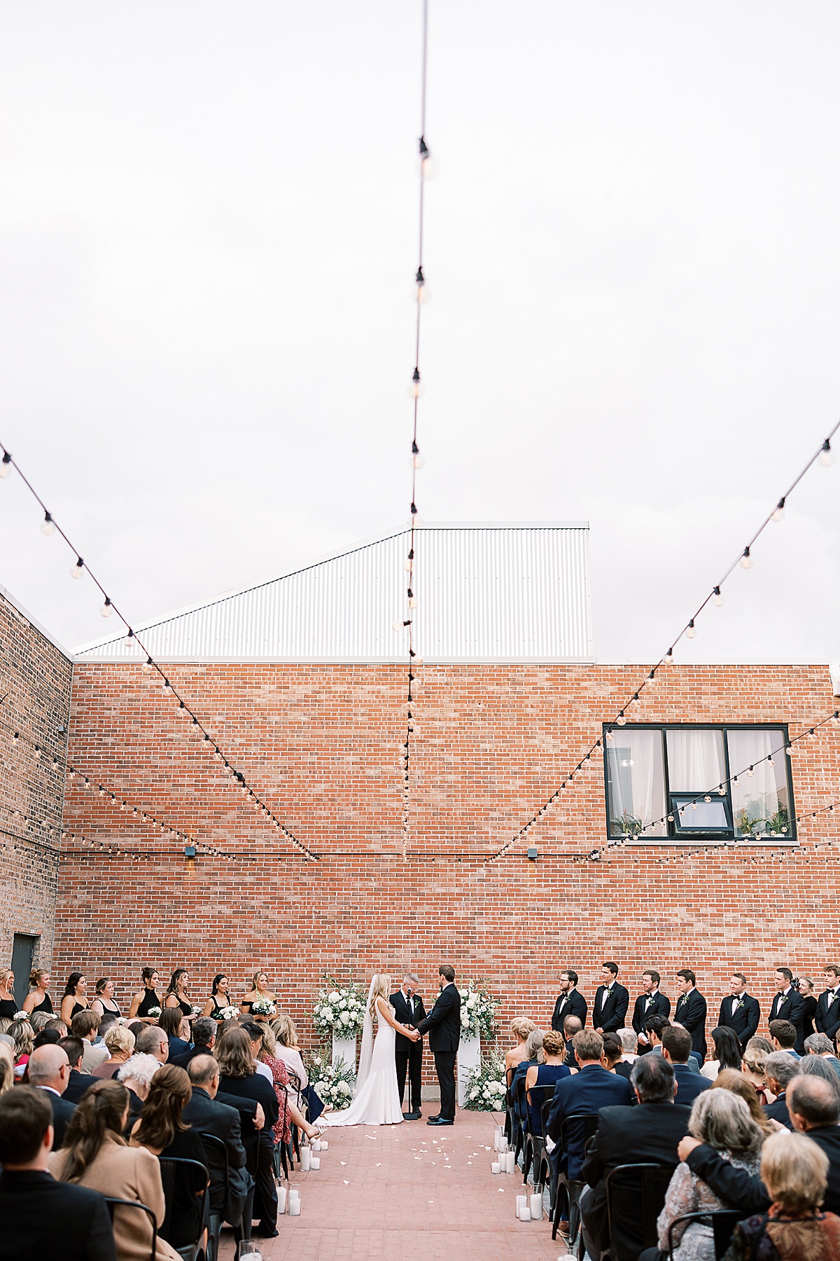 Couple standing at the front of wedding ceremony