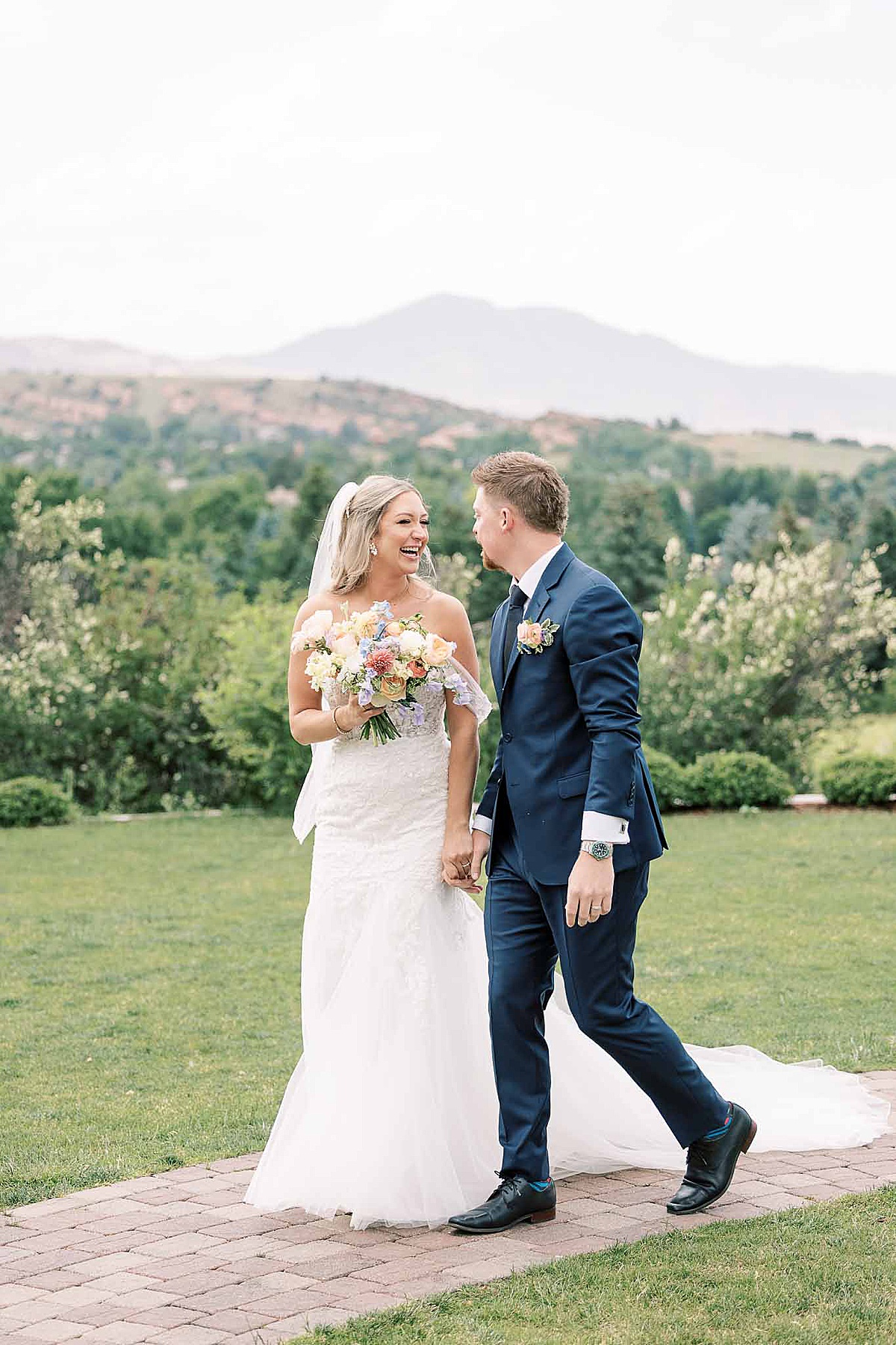 Couple smiling at each other walking out of ceremony