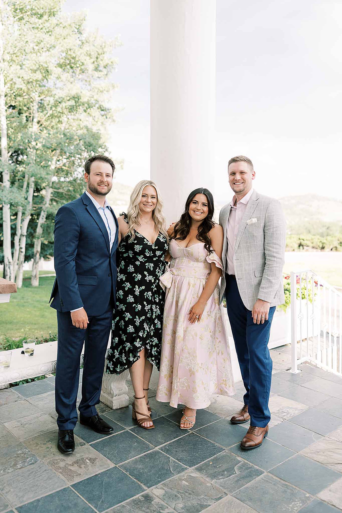 Wedding guests in front of white pole