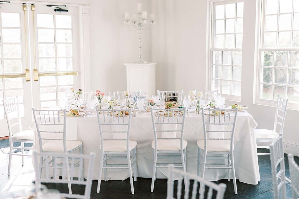 White table and white chair in a wedding reception